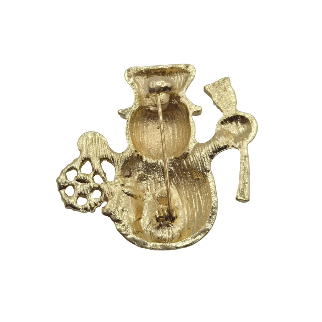 Reverse gold tone side of a snowman brooch showing the pin mechanism, displayed against a plain white background.