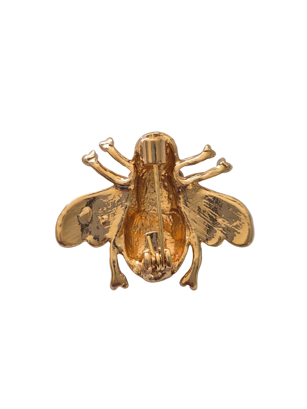 bee brooch on white background