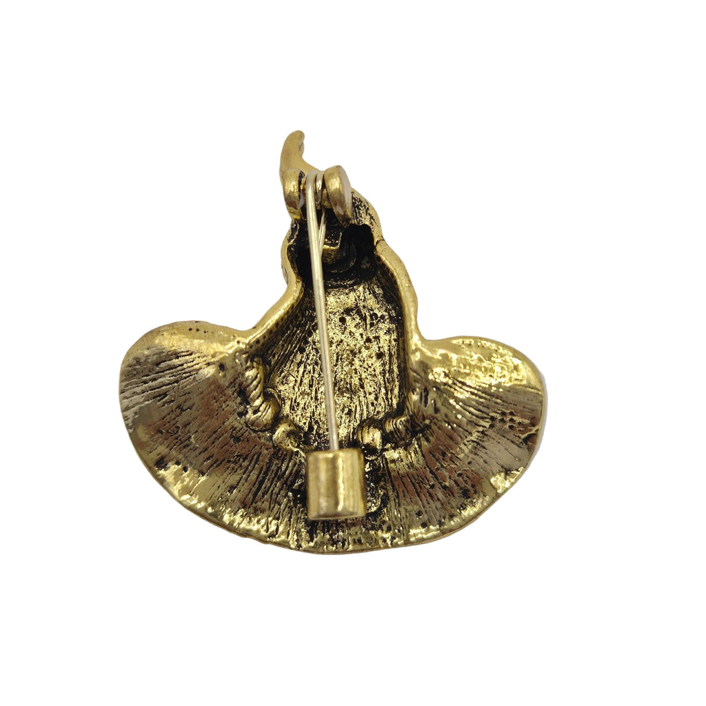 A gold-tone metal pin featuring a textured, witches hat showing the reverse side. photographed on a plain white background.