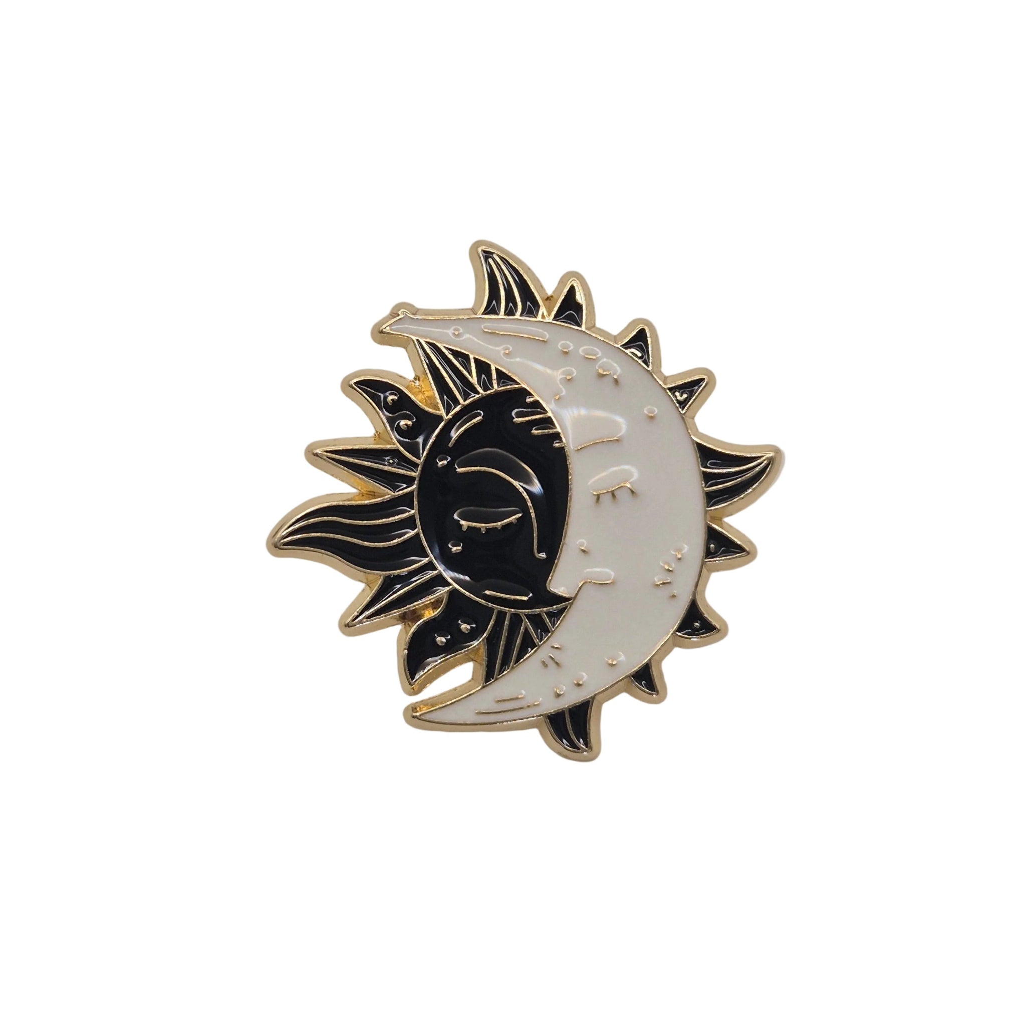 A crescent moon and sun enamel pin with a black, white, and gold color scheme, set against a plain white background.