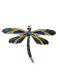 Dragonfly-shaped brooch with blue and green colors on a white background