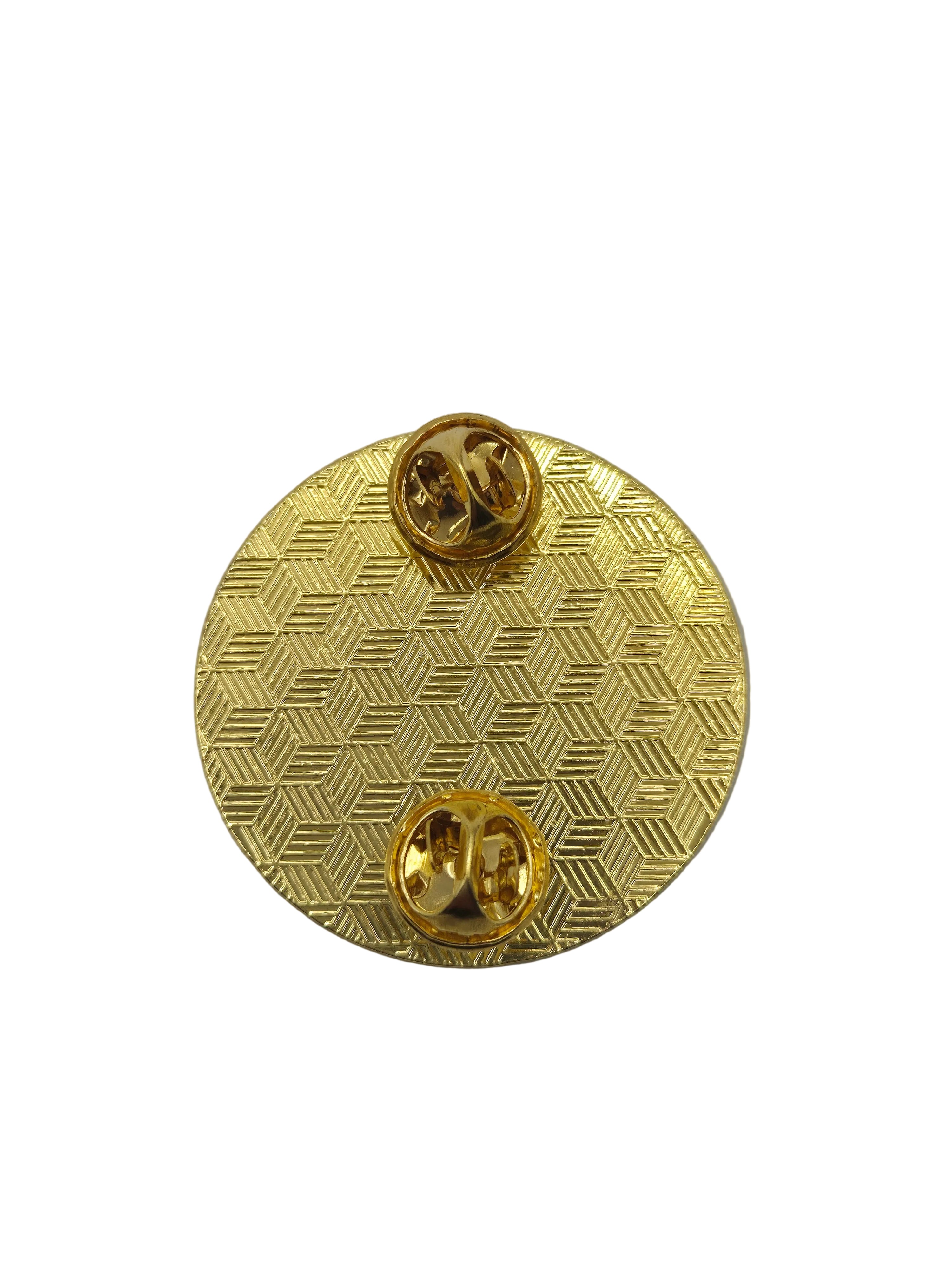 Gold textured birthday brooch circular cutouts on a gray background