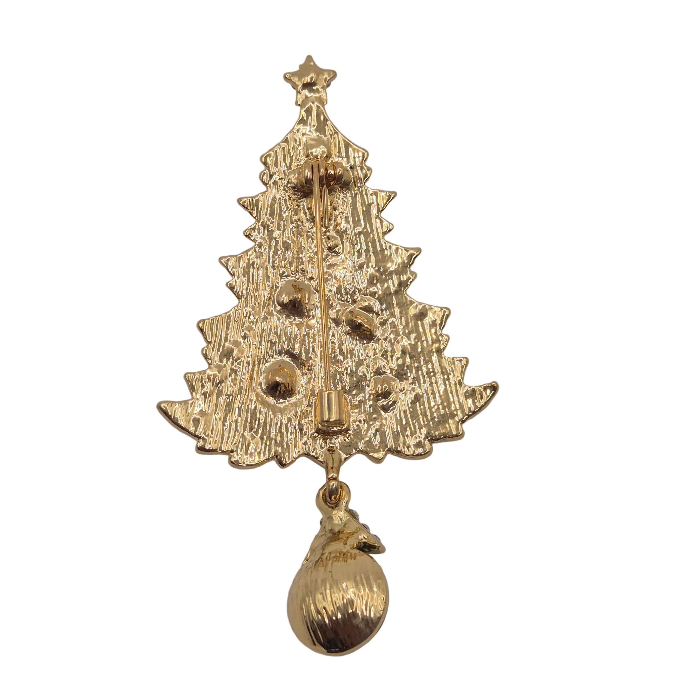 A gold Christmas tree-shaped brooch with a hanging ornament, shown against a plain white background.