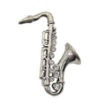 Silver tone metal saxophone brooch with rhinestone detail. Shown on a plain white background.