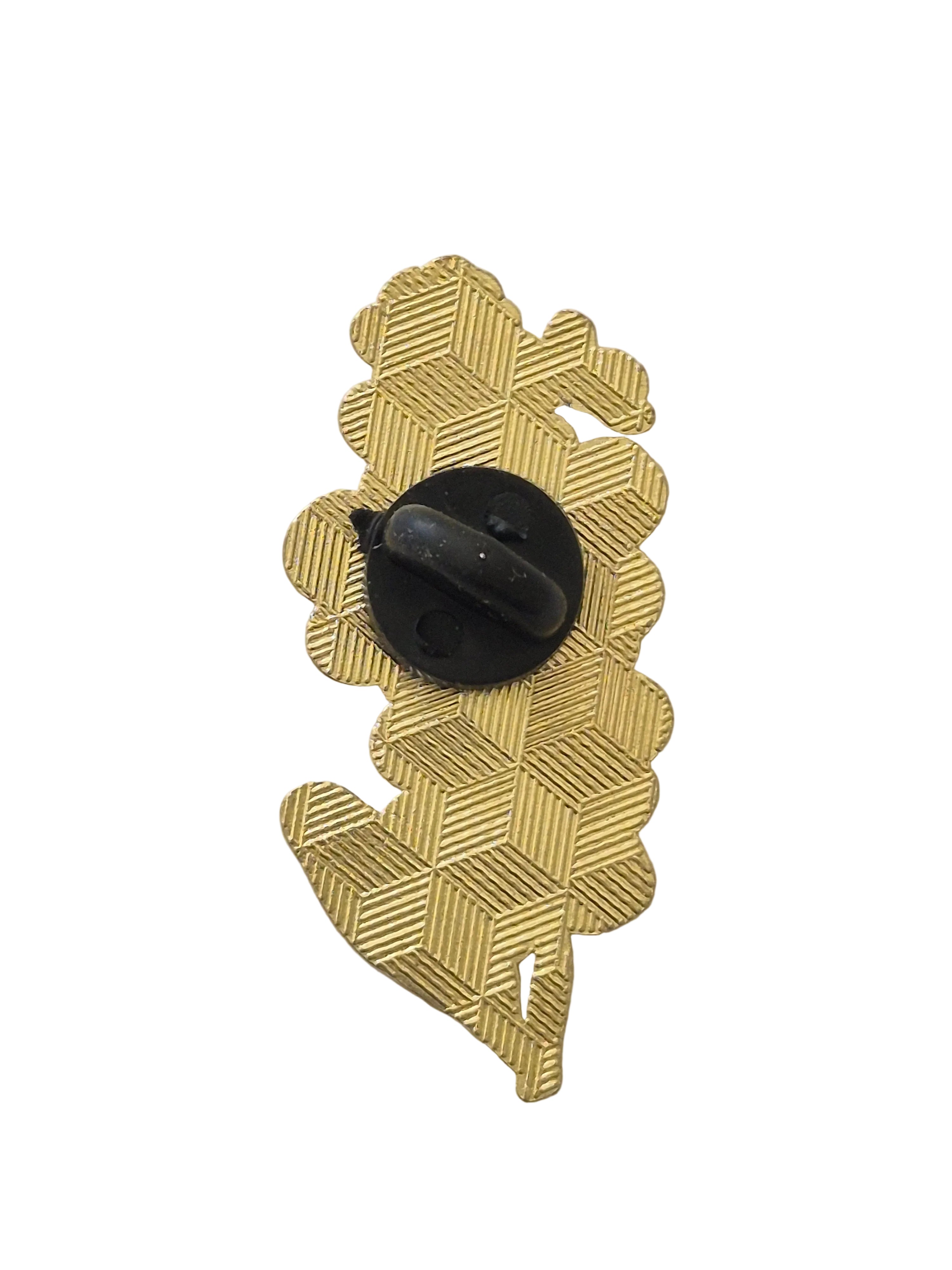 forget me not brooch with a black center on a white background