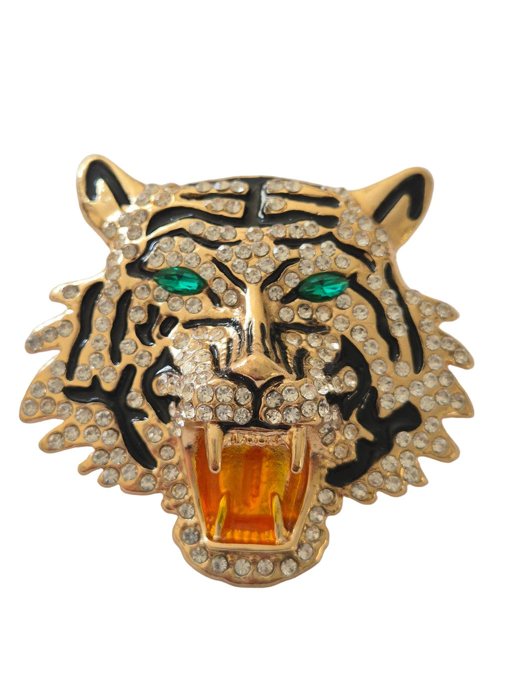 Gold tiger head brooch with green eyes and orange mouth on a white background