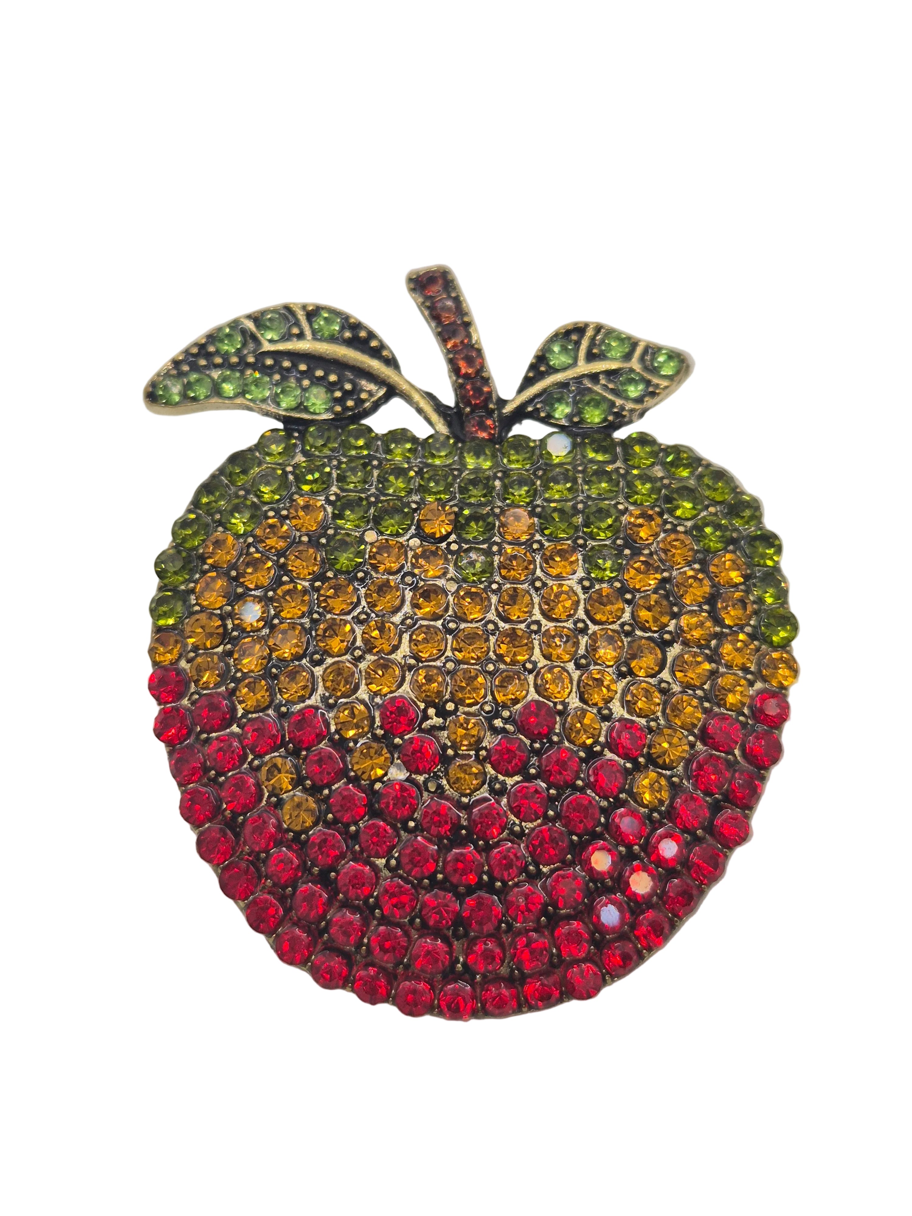 rhinestone apple-shaped brooch with multicolored gemstones on a white background