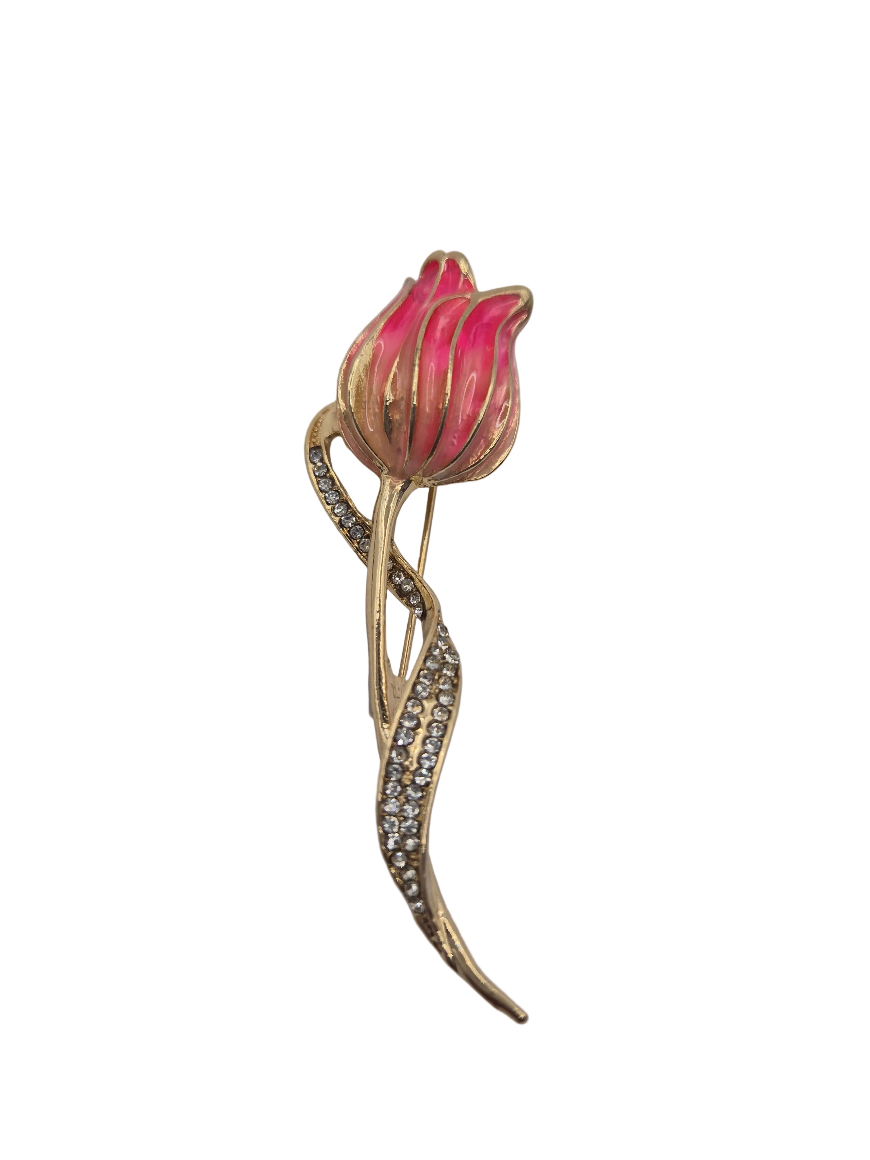 Pink tulip-shaped brooch with gold detailing on a white background