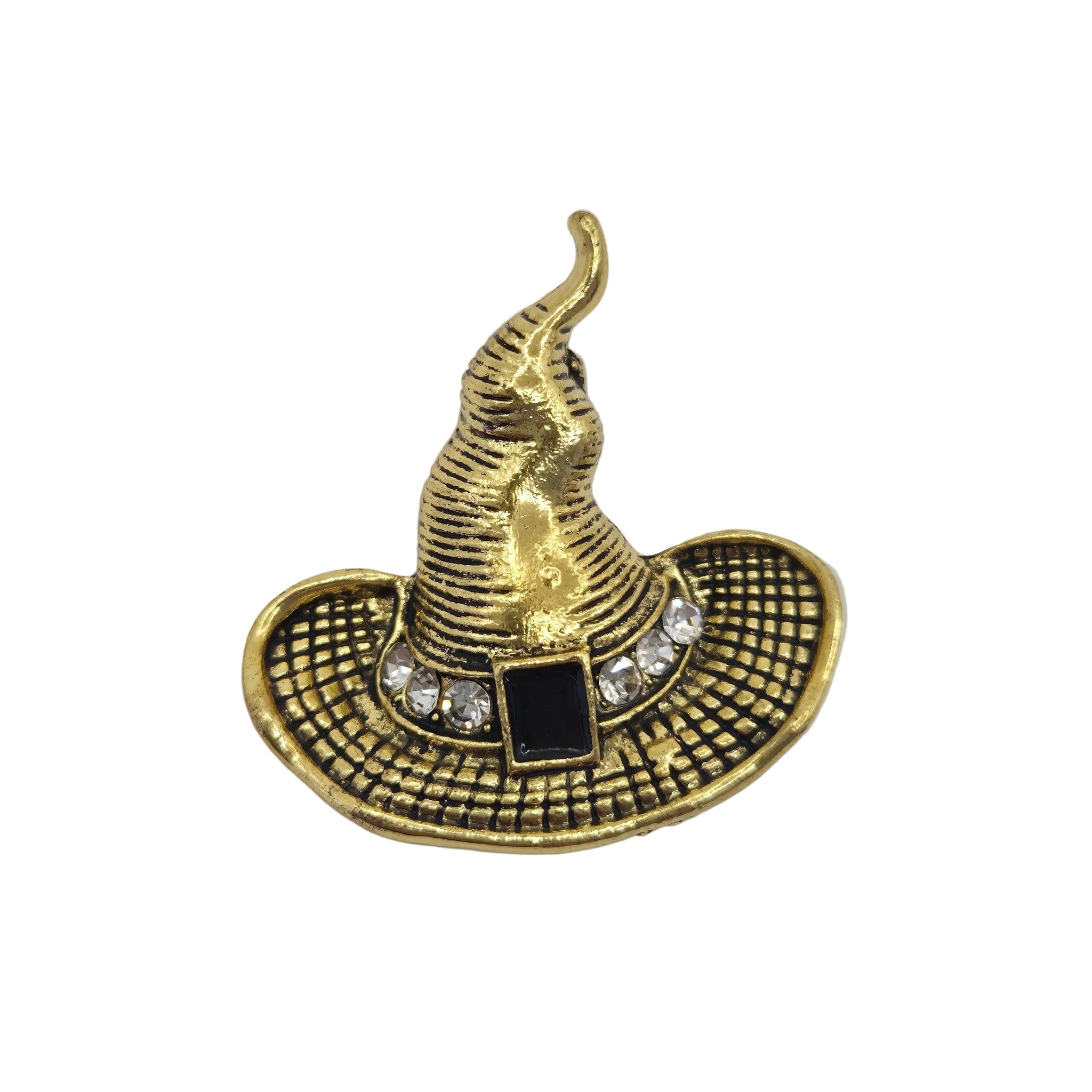 A gold-colored witch hat brooch with a textured, ribbed finish, featuring a black rectangular buckle detail and a row of clear rhinestones around the band, set against a plain white background.