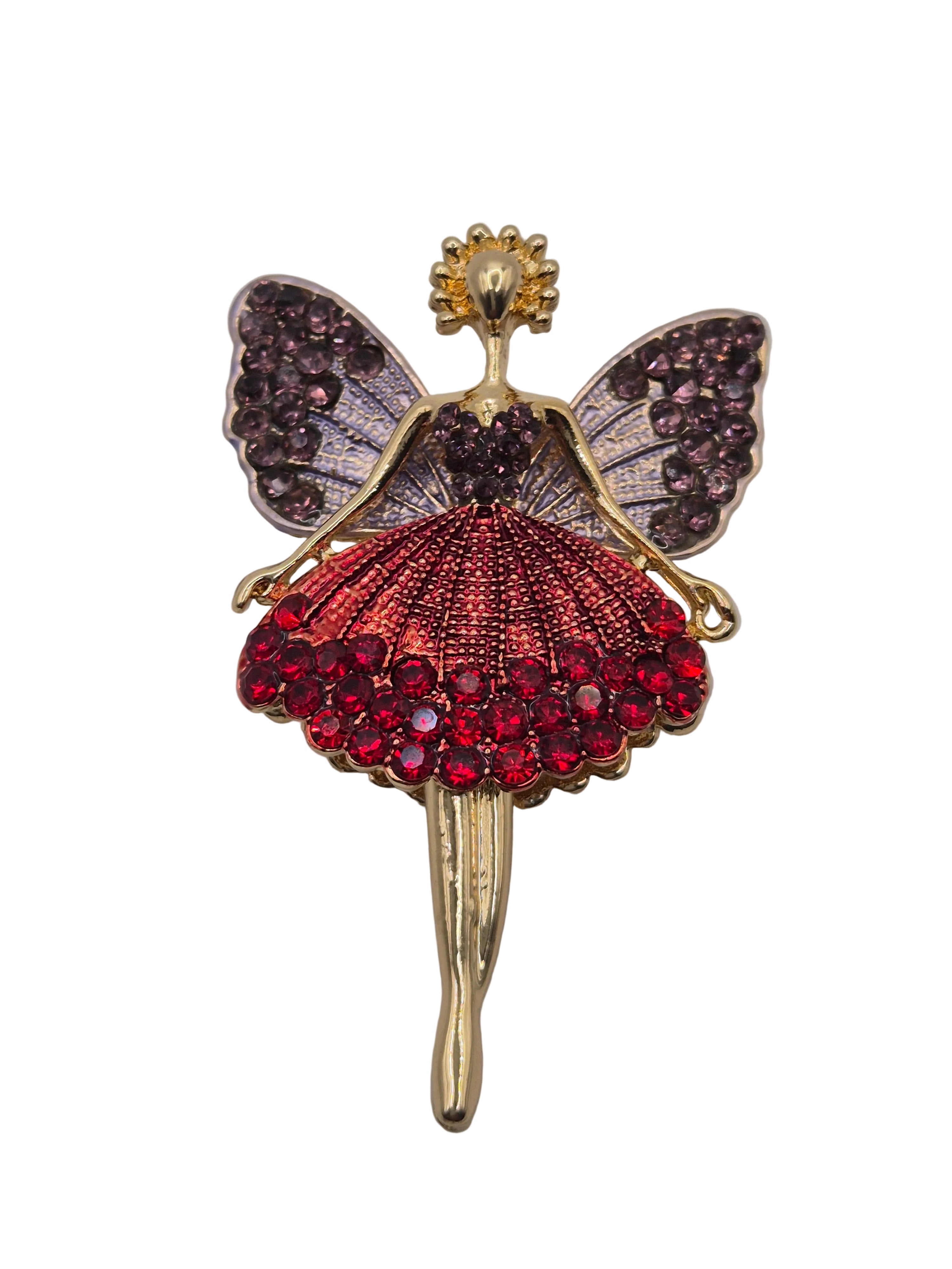 fairy brooch on plain background