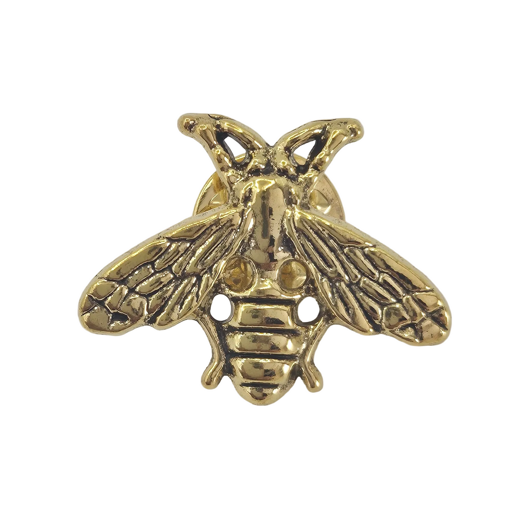 A gold-colored bee-shaped pin or charm with detailed wing and body textures, shown against a plain white background.