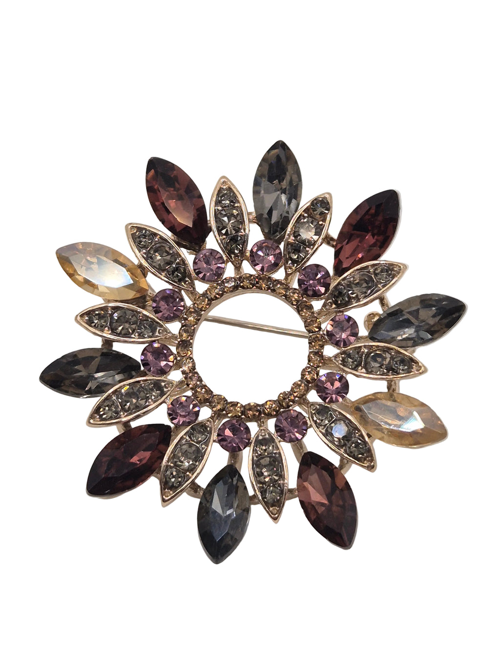 Jewelled wreath brooch with multicolored gemstones on a white background