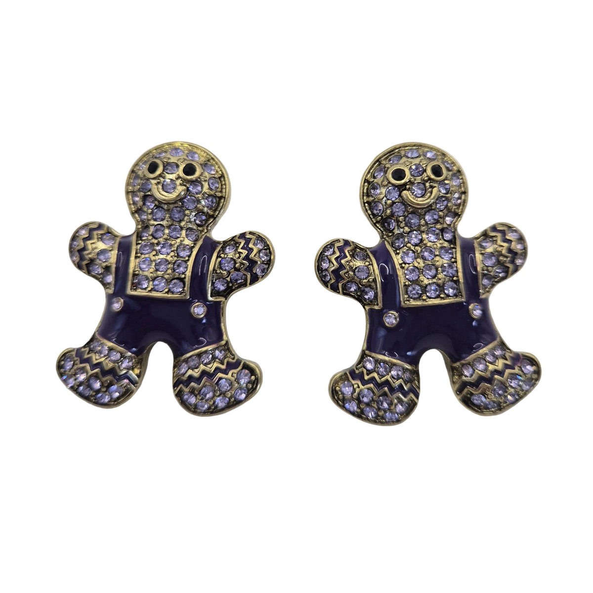 A pair of gingerbread man stud earrings with dark purple enamel, gold-toned outlines, and rhinestone-embellished details, shown on a plain white background.