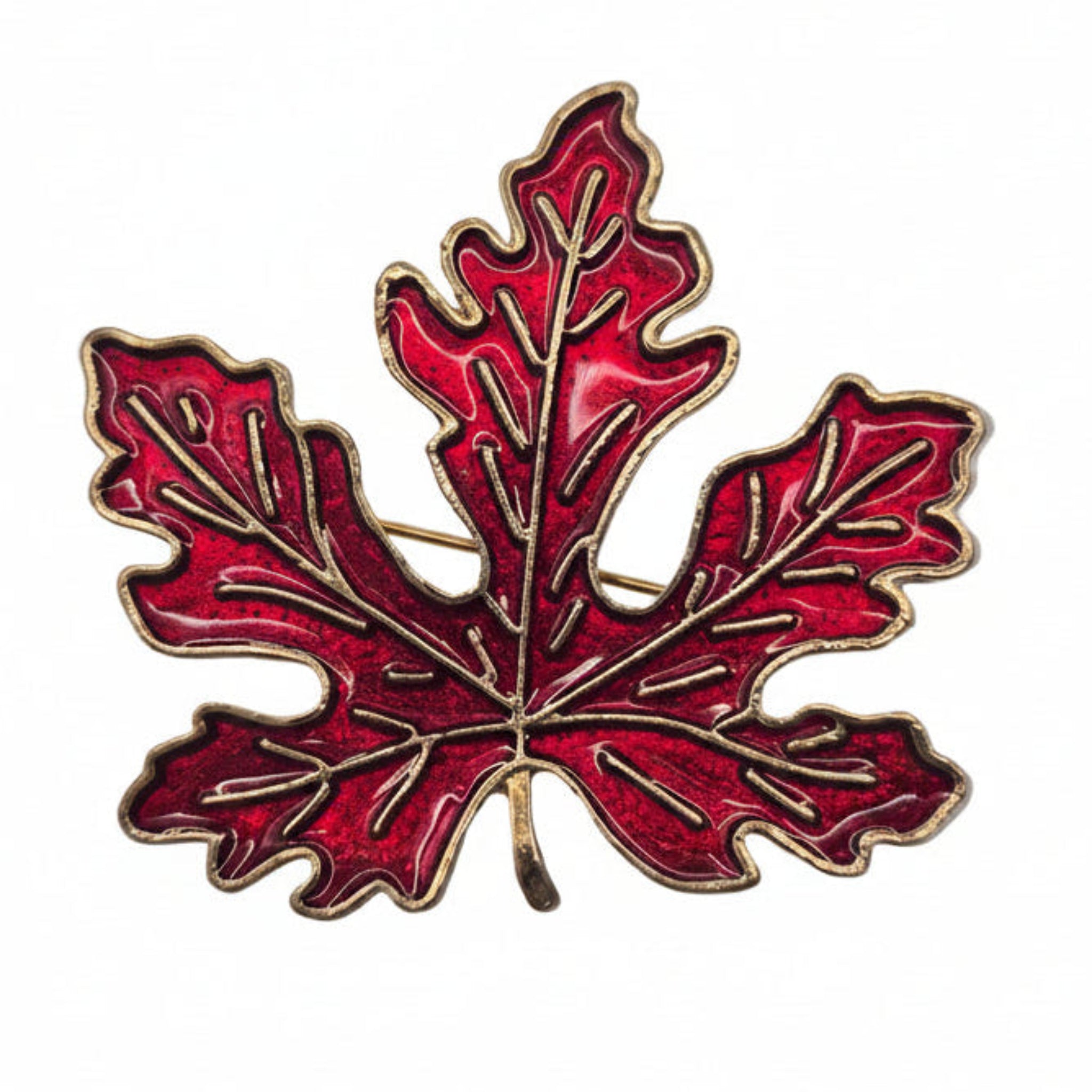 A red maple leaf enamel pin with gold-toned metal outlines and vein details, centered on a plain white background.