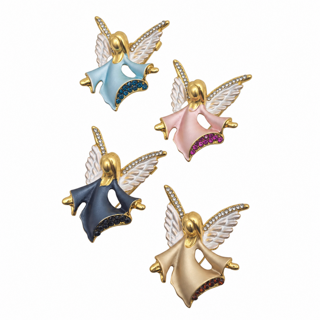 Four angel wing brooches with white enamel wings and colorful enamel dresses in light blue, pink, navy, and champagne, arranged on a plain white background.