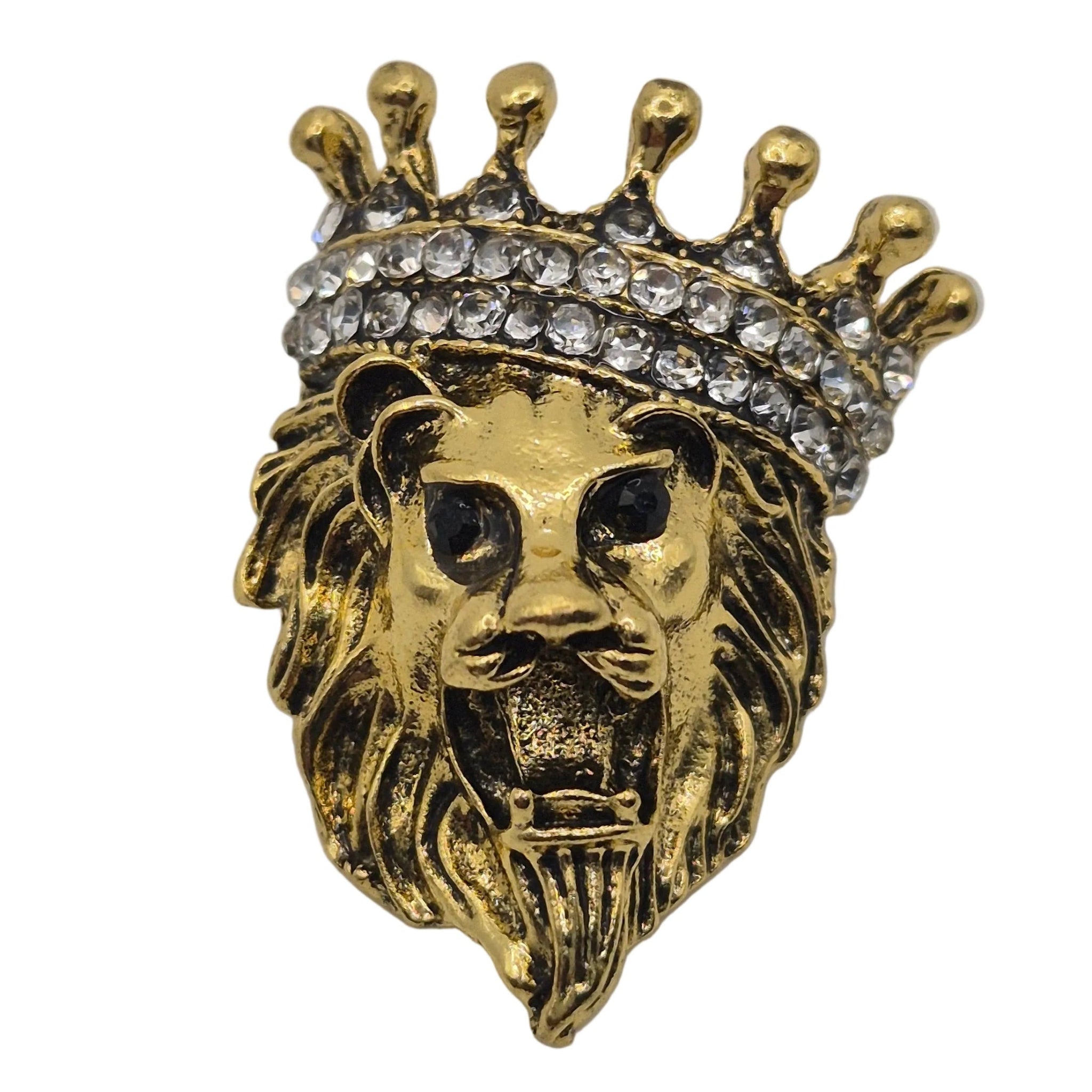 A gold lion head brooch or pin wearing a crown adorned with clear rhinestones, shown against a plain white background.
