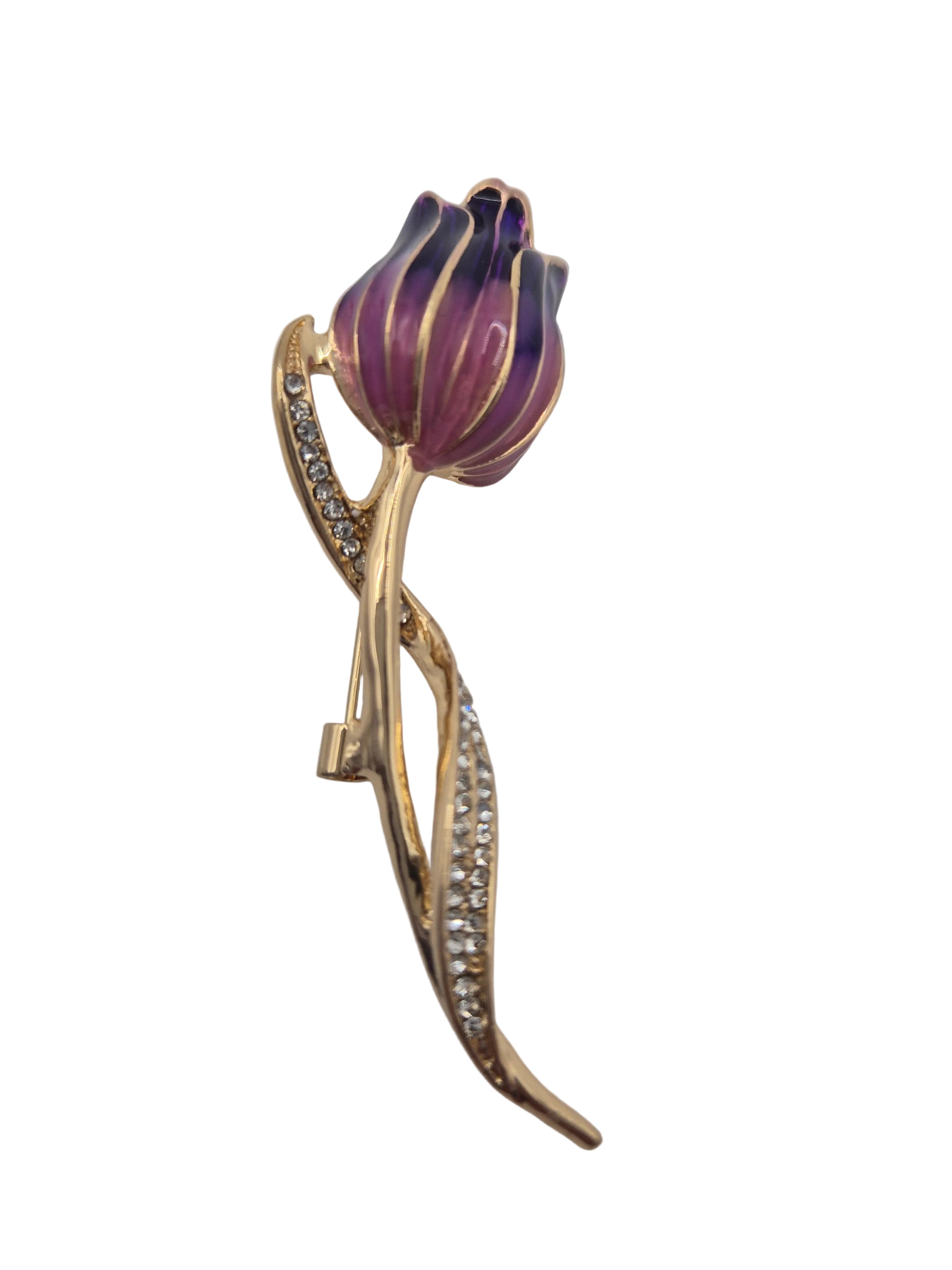 Purple tulip-shaped brooch with gold accents on a white background