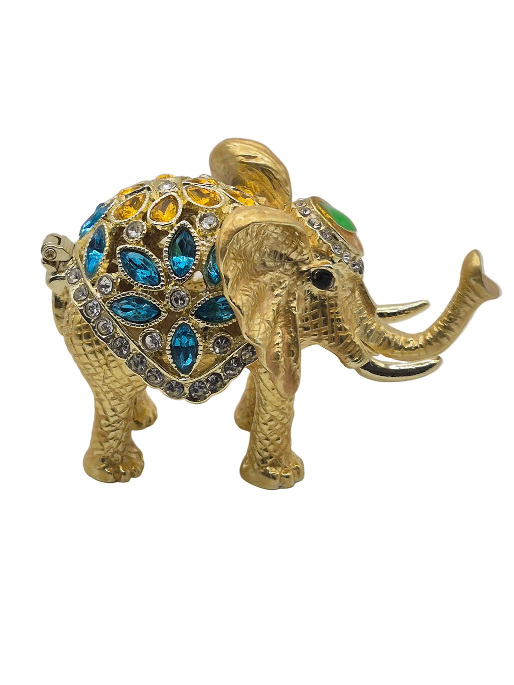 Gold elephant trinket dish with gemstones on white background