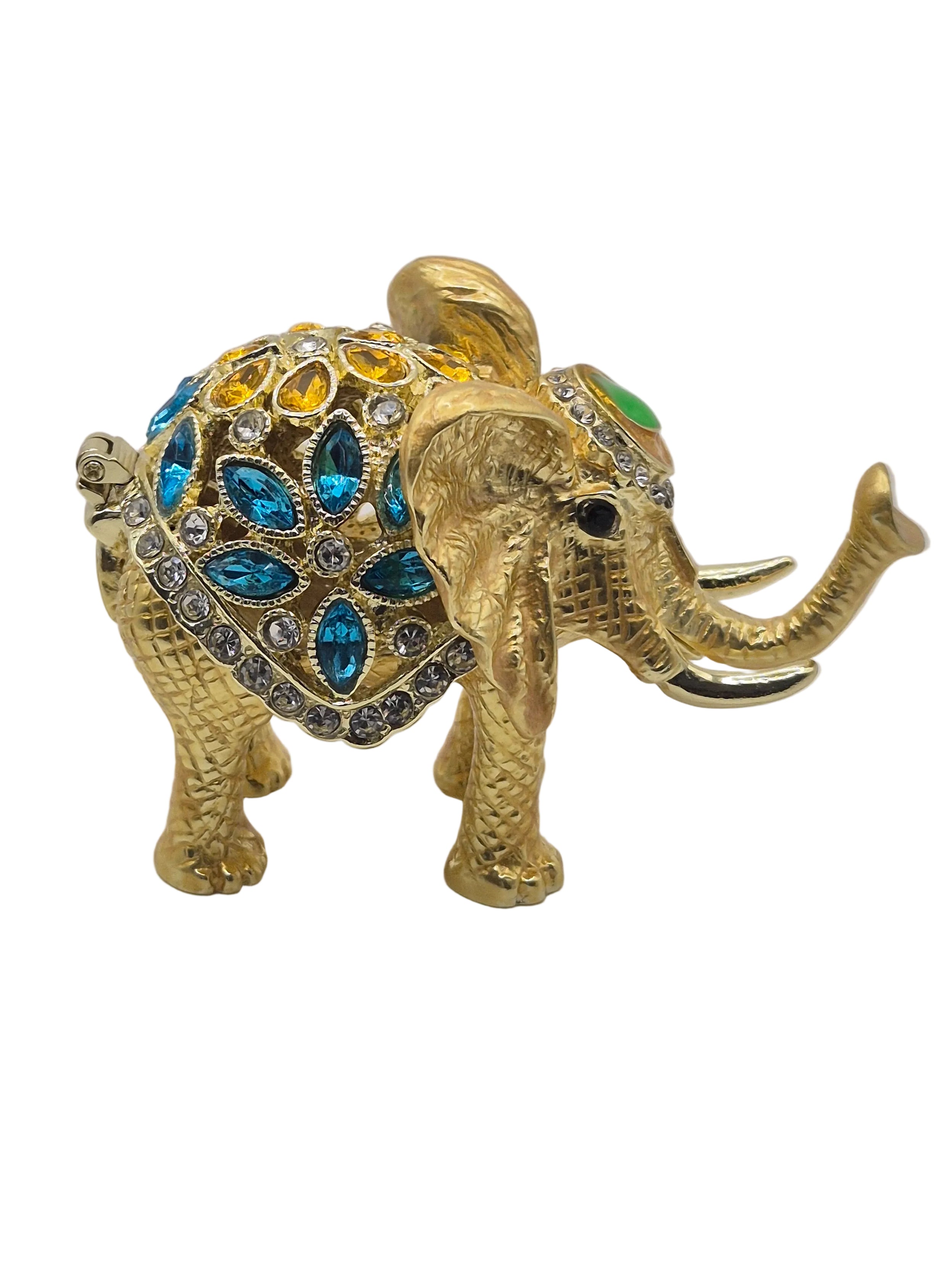 Gold elephant trinket dish with gemstones on white background