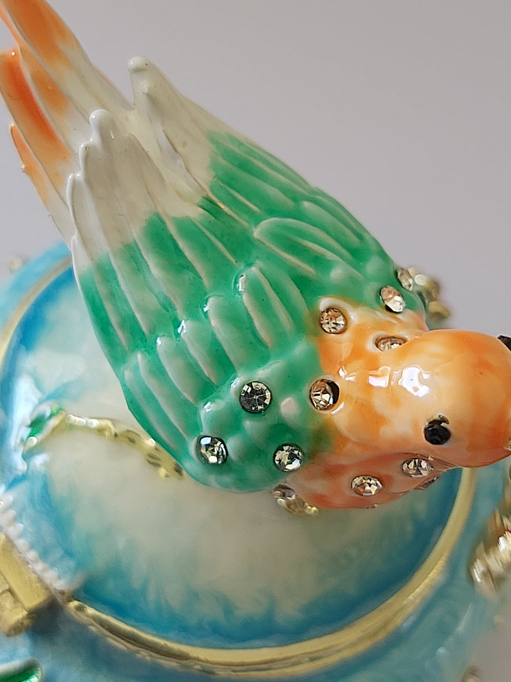 bird trinket pot with rhinestones carrying flower
