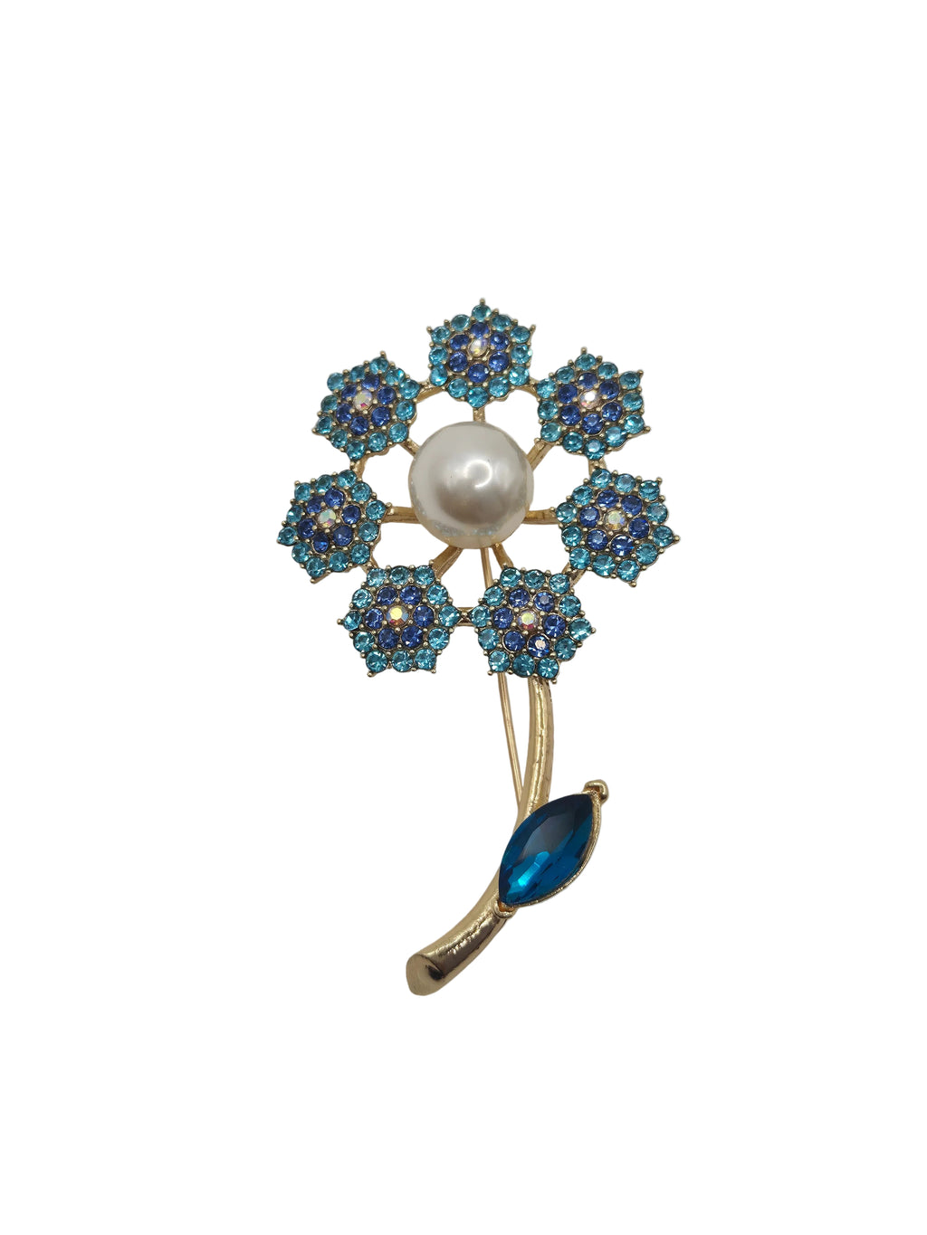 Jewelry brooch with blue gemstones and a pearl on a gray background