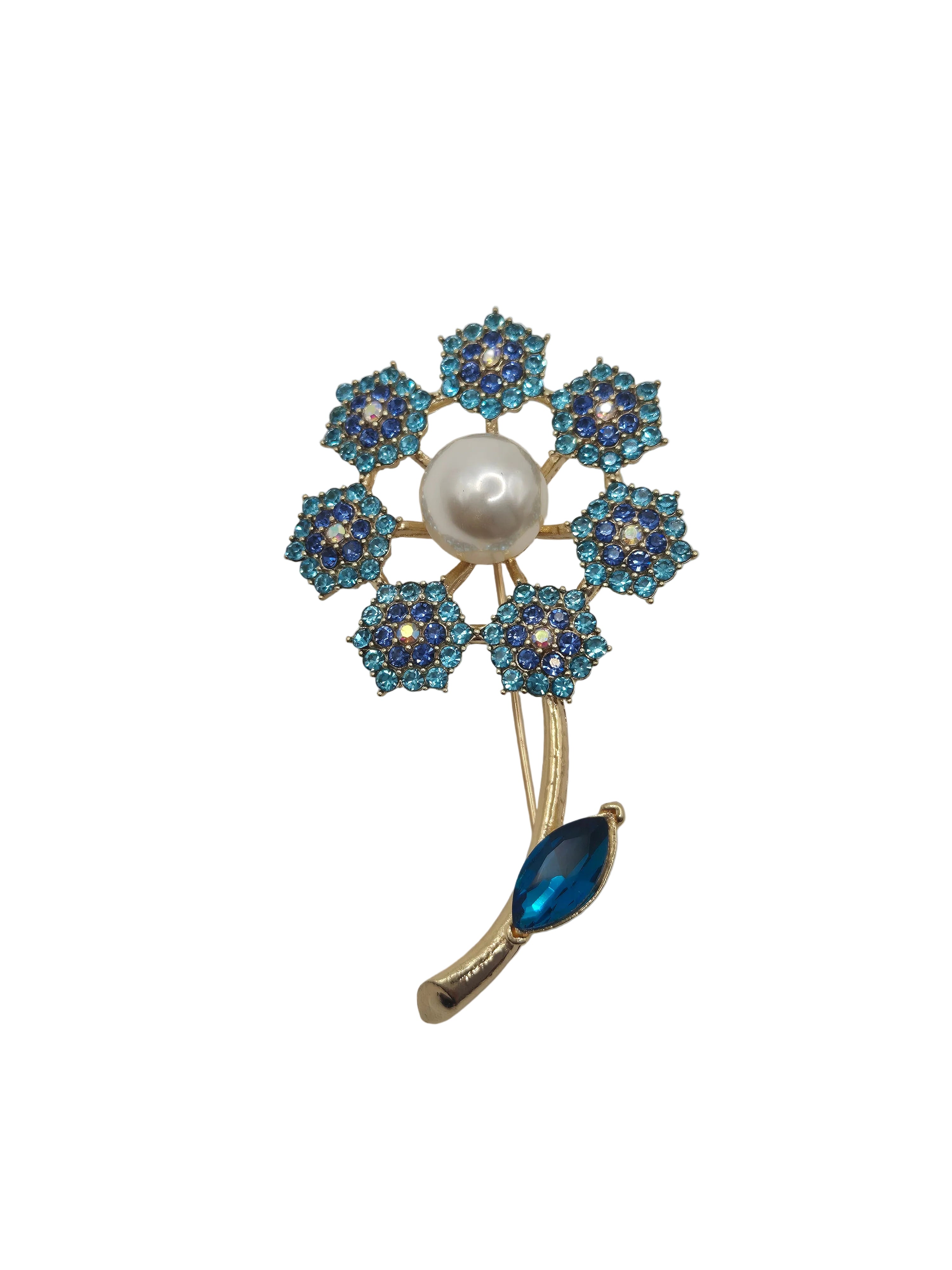 Jewelry brooch with blue gemstones and a pearl on a gray background