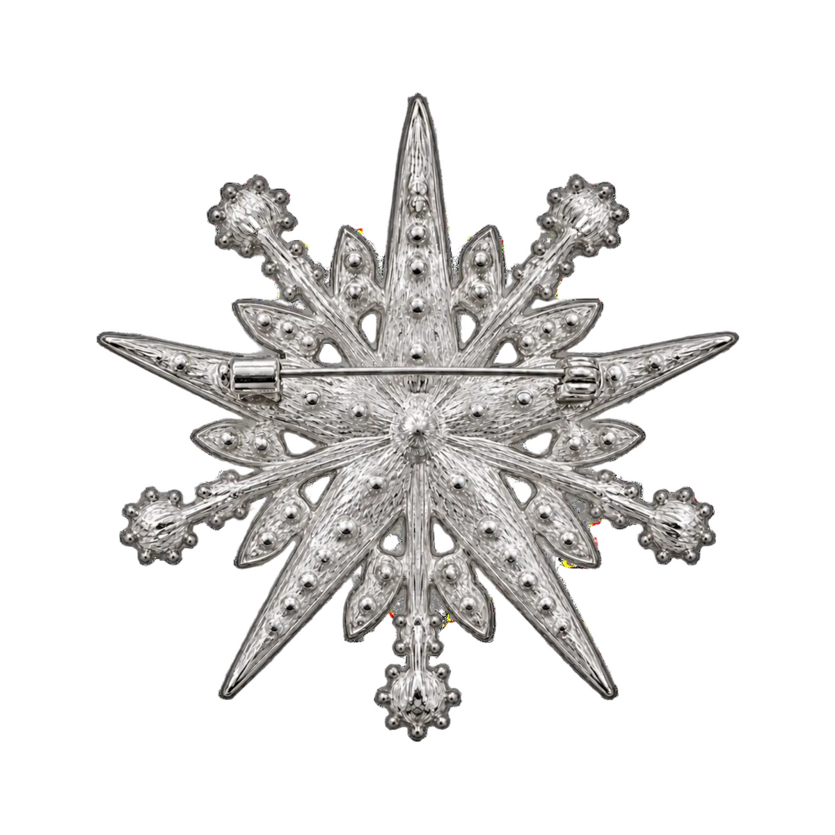 A silver-toned Christmas star brooch with textured detailing and small bead accents, shown flat against a plain white background.