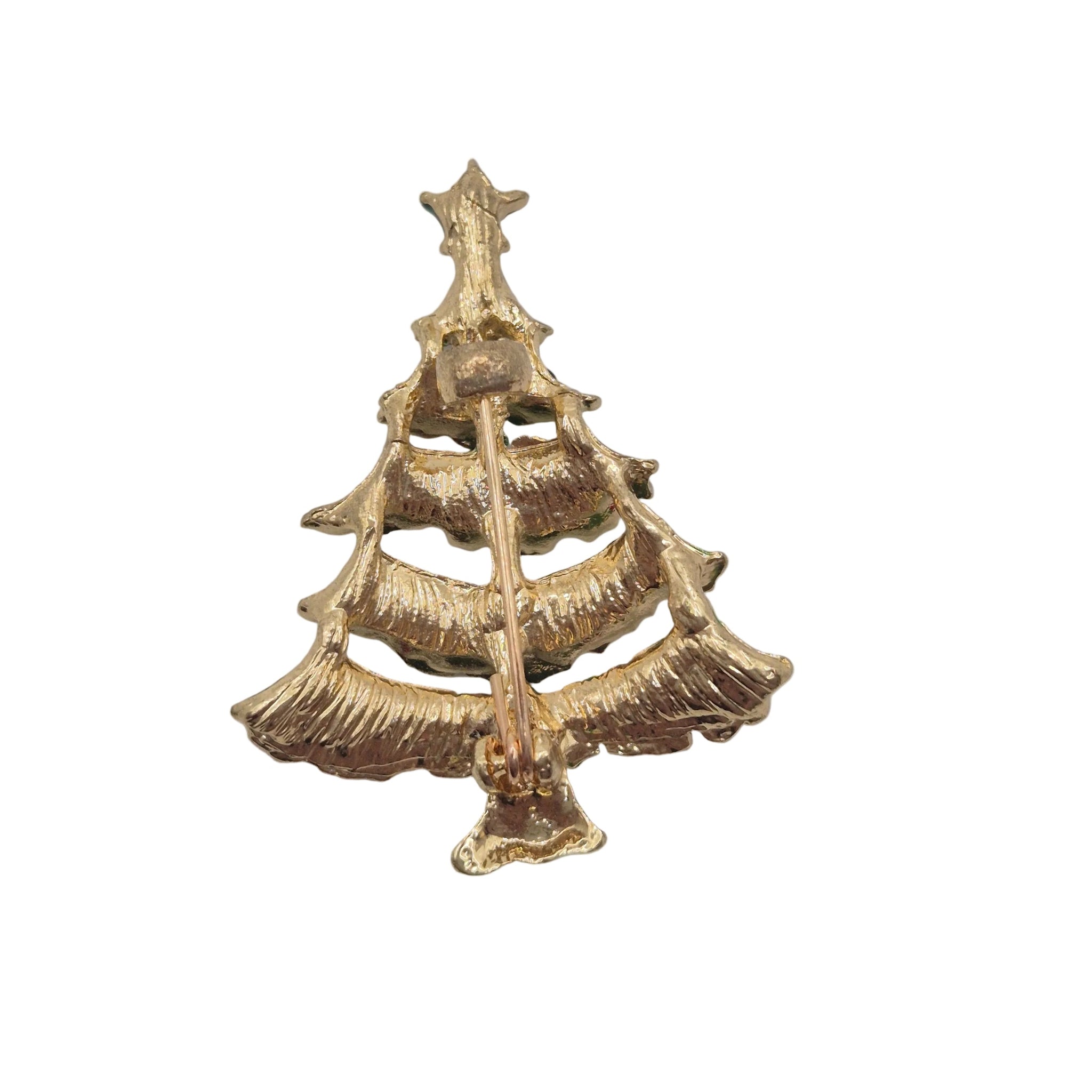 A gold Christmas tree-shaped brooch with a textured finish and a central pin fastener, shown on a plain white background.