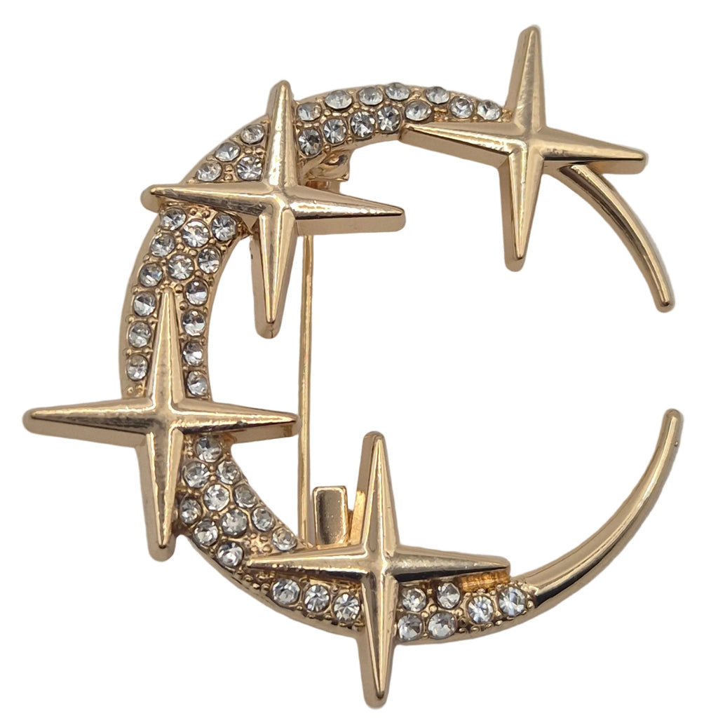 Gold rhinestone moon and stars celestial brooch on white background