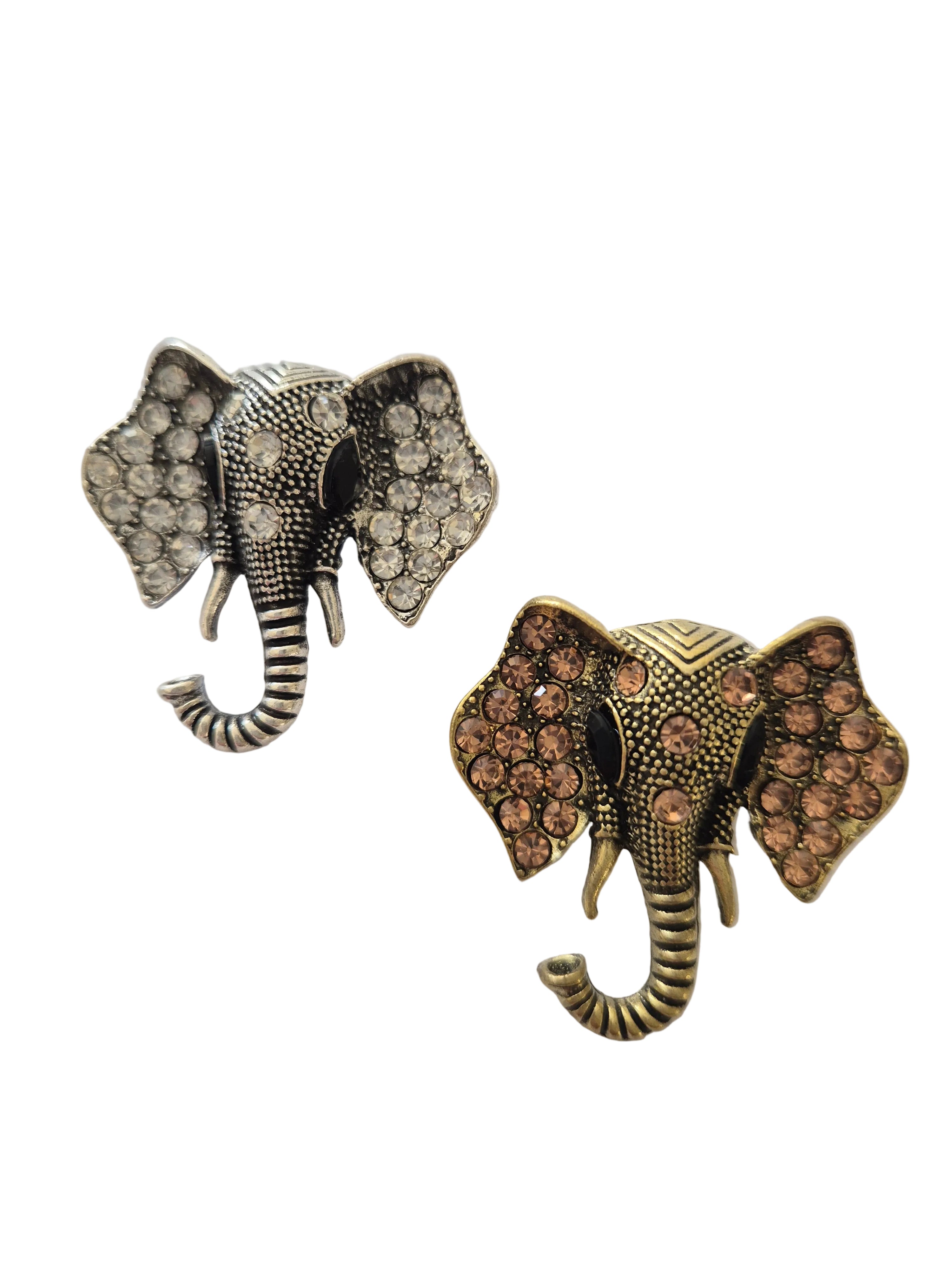 Pair of elephant-shaped brooch with rhinestone details on a white background
