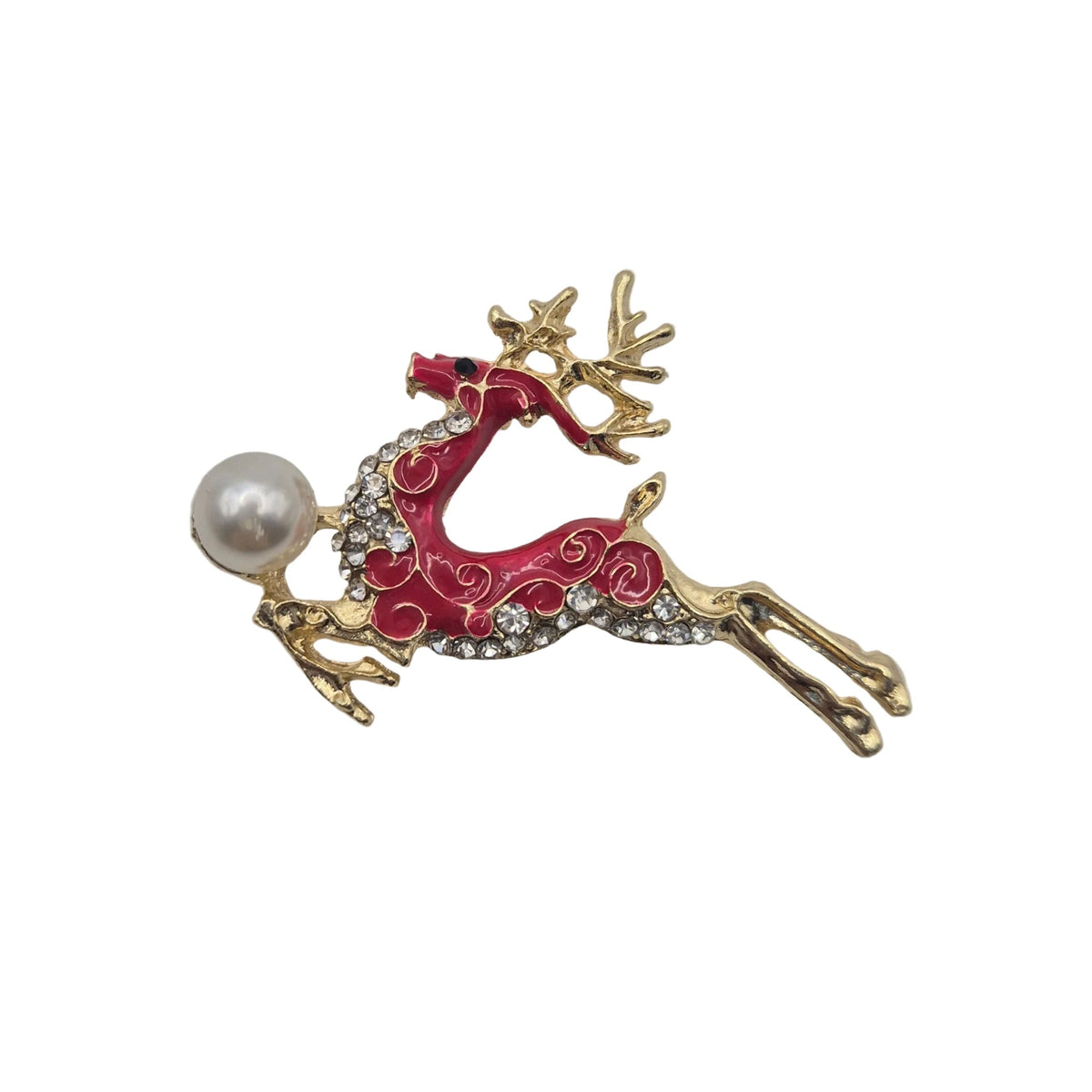 A gold-toned reindeer brooch with red enamel, clear rhinestones, and a white faux-pearl bead, shown on a plain white background.