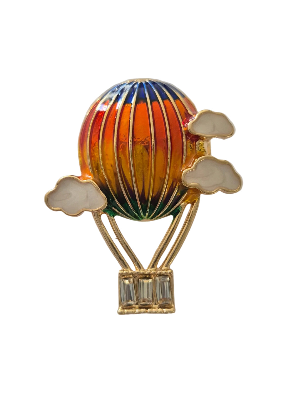 Hot air balloon brooch with orange and blue design on a white background