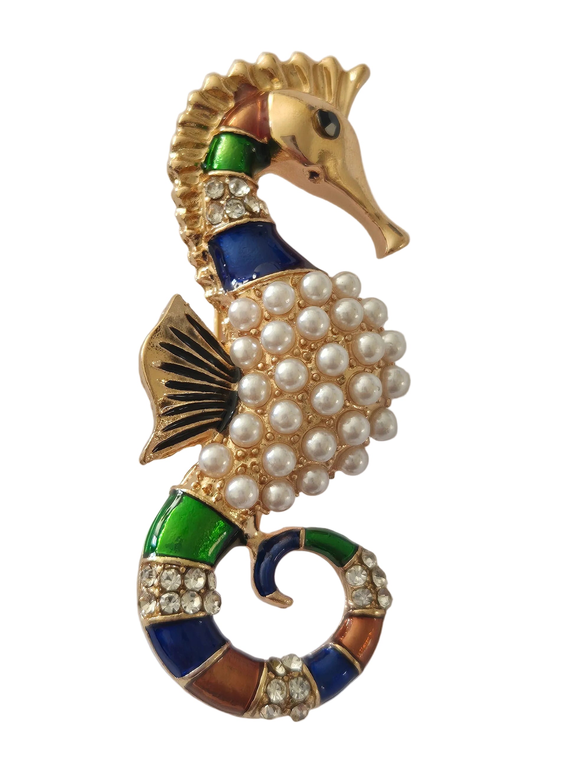 decorative seahorse brooch on a light gray background