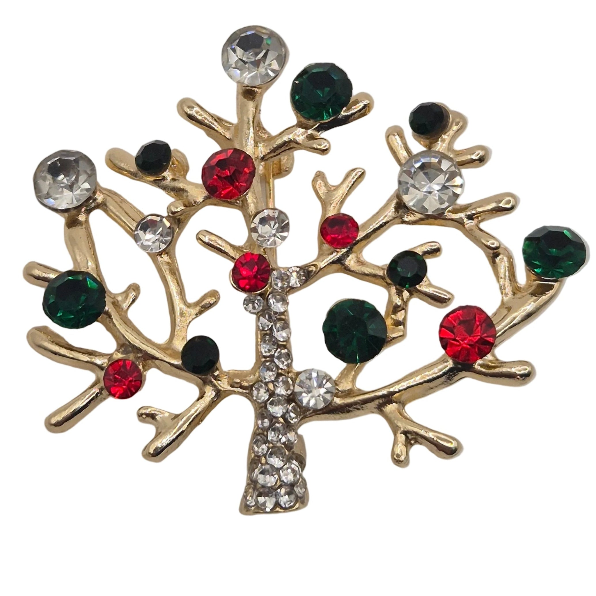 A gold-toned tree-shaped brooch or pin decorated with faceted rhinestones in red, dark green, and clear, shown on a plain white background.